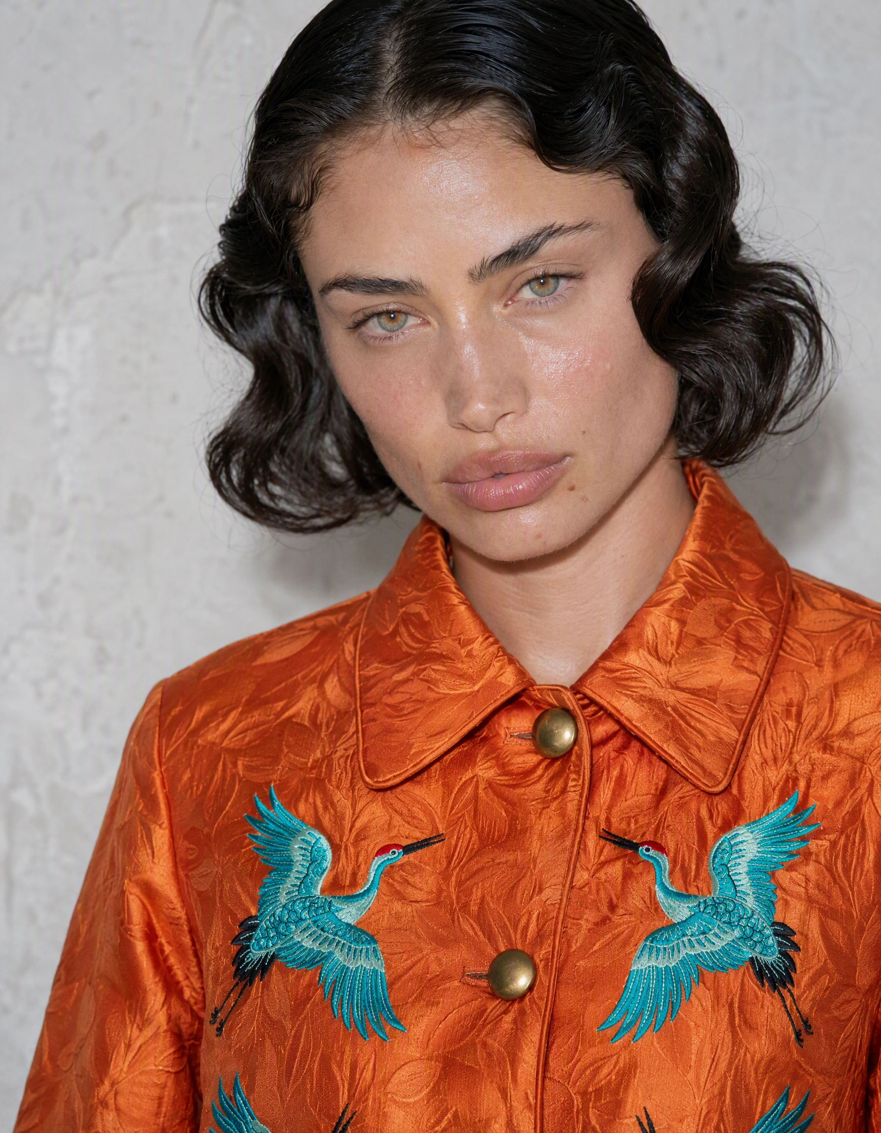 Supplied synthetic adult casting reference, already wearing the orange jacket