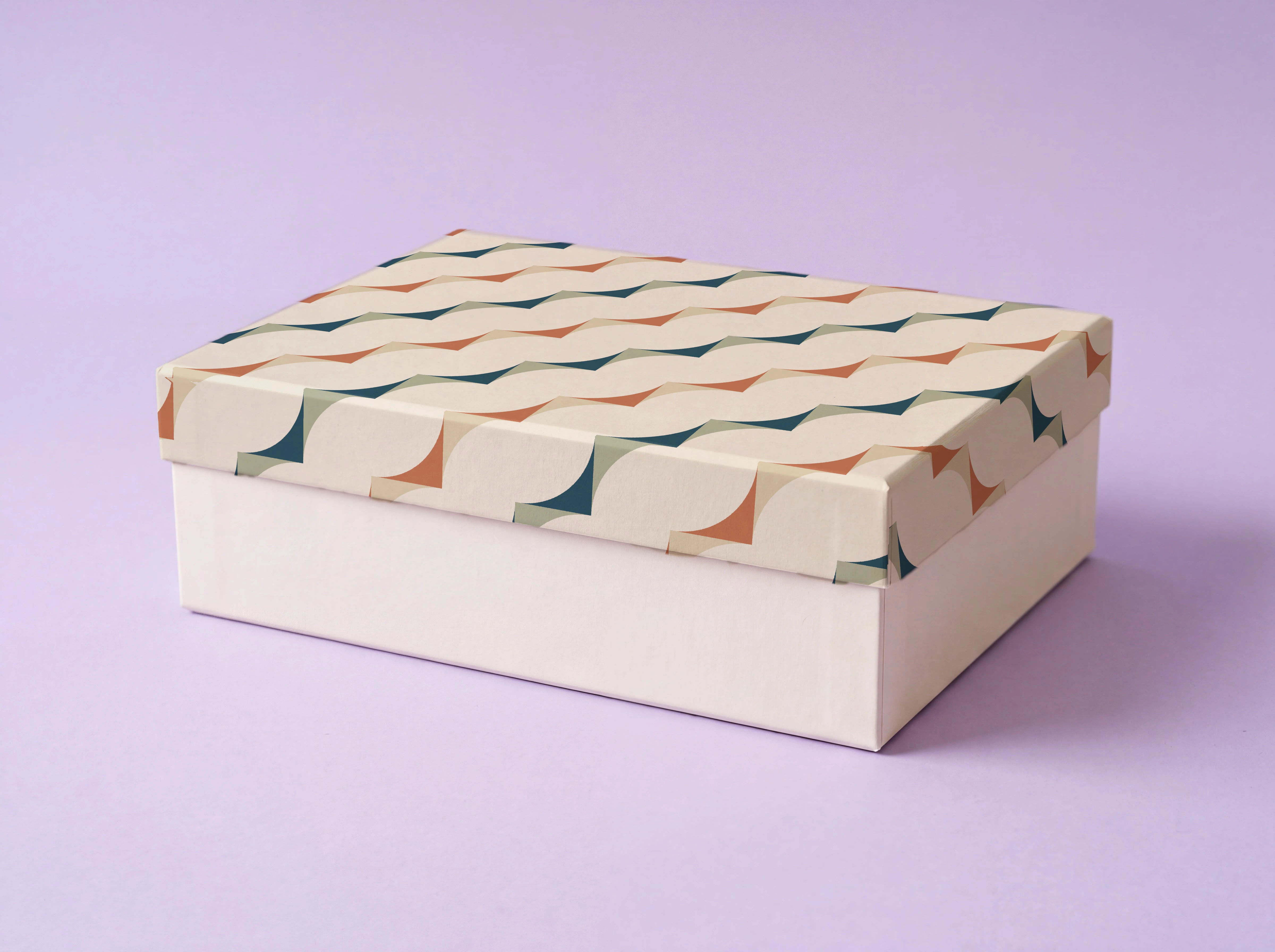 Same presentation-box image after the supplied geometric repeat is applied to the lid in Mockup Lab
