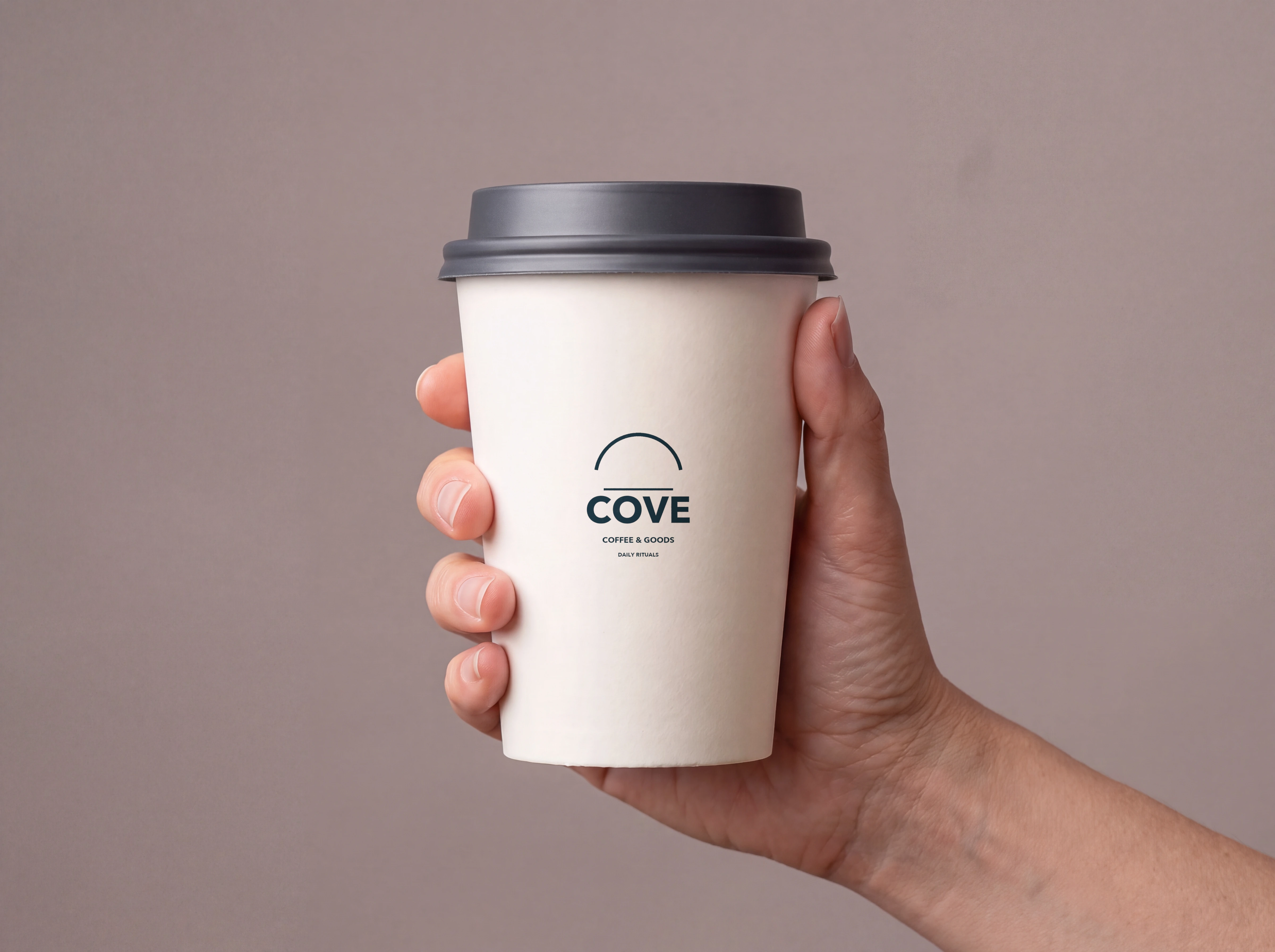 Same paper cup after placing the supplied COVE mark as a single print, with the hand and lid excluded