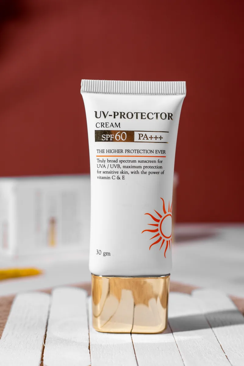 Supplied photograph of a white and gold UV protector cream tube used as the product reference