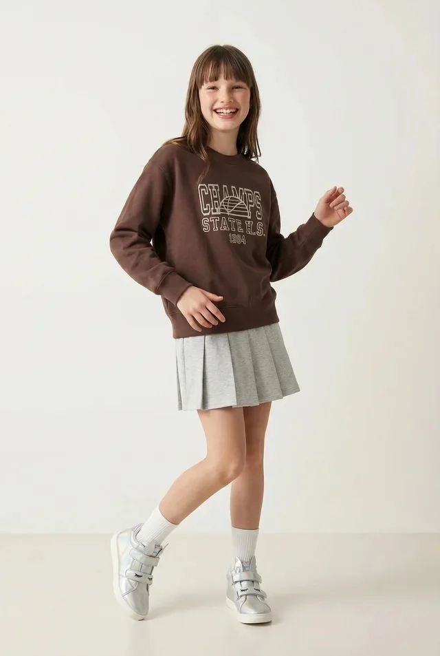 Generated model wearing the referenced sweatshirt with a skirt, socks, and shoes